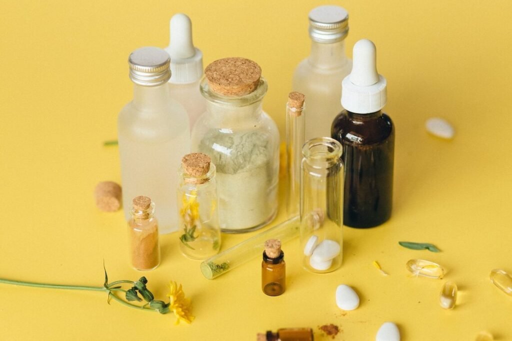 10 Essential Tips for Melanin-Rich Skincare. An image showing bottles, pills for skincare